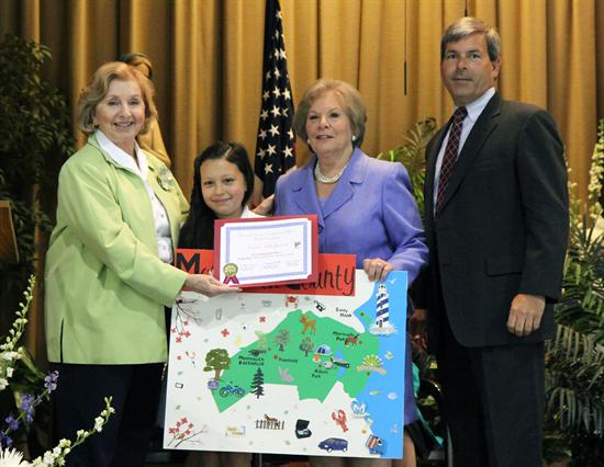 Monmouth County Clerk M. Claire French, Surrogate Rosemarie D. Peters and Undersheriff Robert J. Dawson Jr. congratulated Natalie Villalpando the winner of the 2012 “My County” poster contest. Villalpando is a fourth grade student at St. Catharine’s school in Spring Lake. 